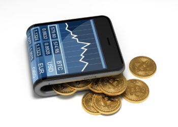 A smartphone resembling the best crypto wallet is placed on a surface, displaying a cryptocurrency exchange app with a graph and currency pairs. Several golden Bitcoin coins are scattered around it. | eCryptoBit.com